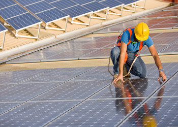 engineer working on solar panel